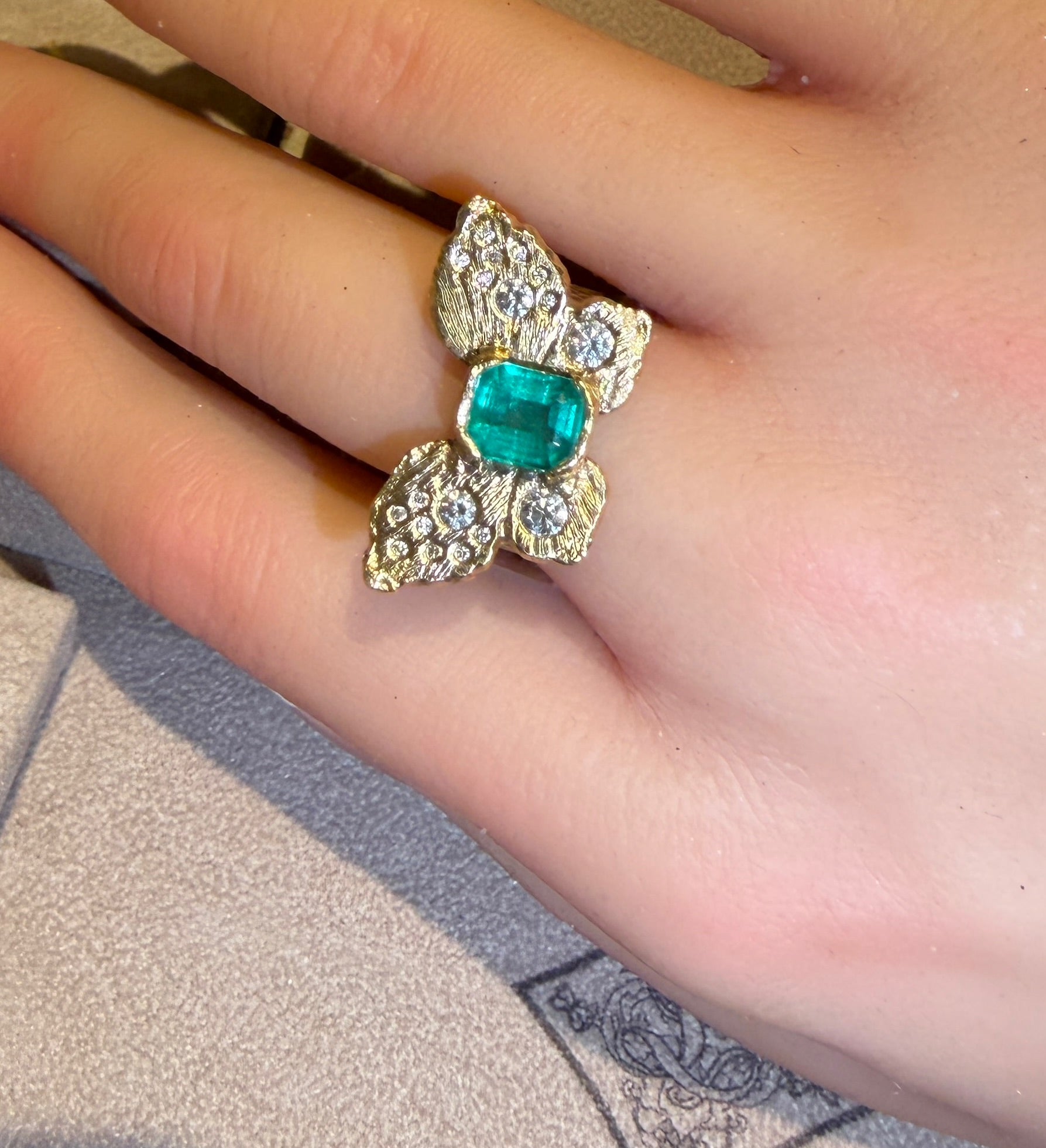 IGI Certified 1.3 Ct Emerald Queen Butterfly Ring with Diamonds in 18 Ct Gold Half Bezel (Available online and also to View in Person at Stardust, London 101 Walton Street)