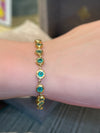 Emerald Bezel Pebbles Tennis Bracelet 18 Ct Gold