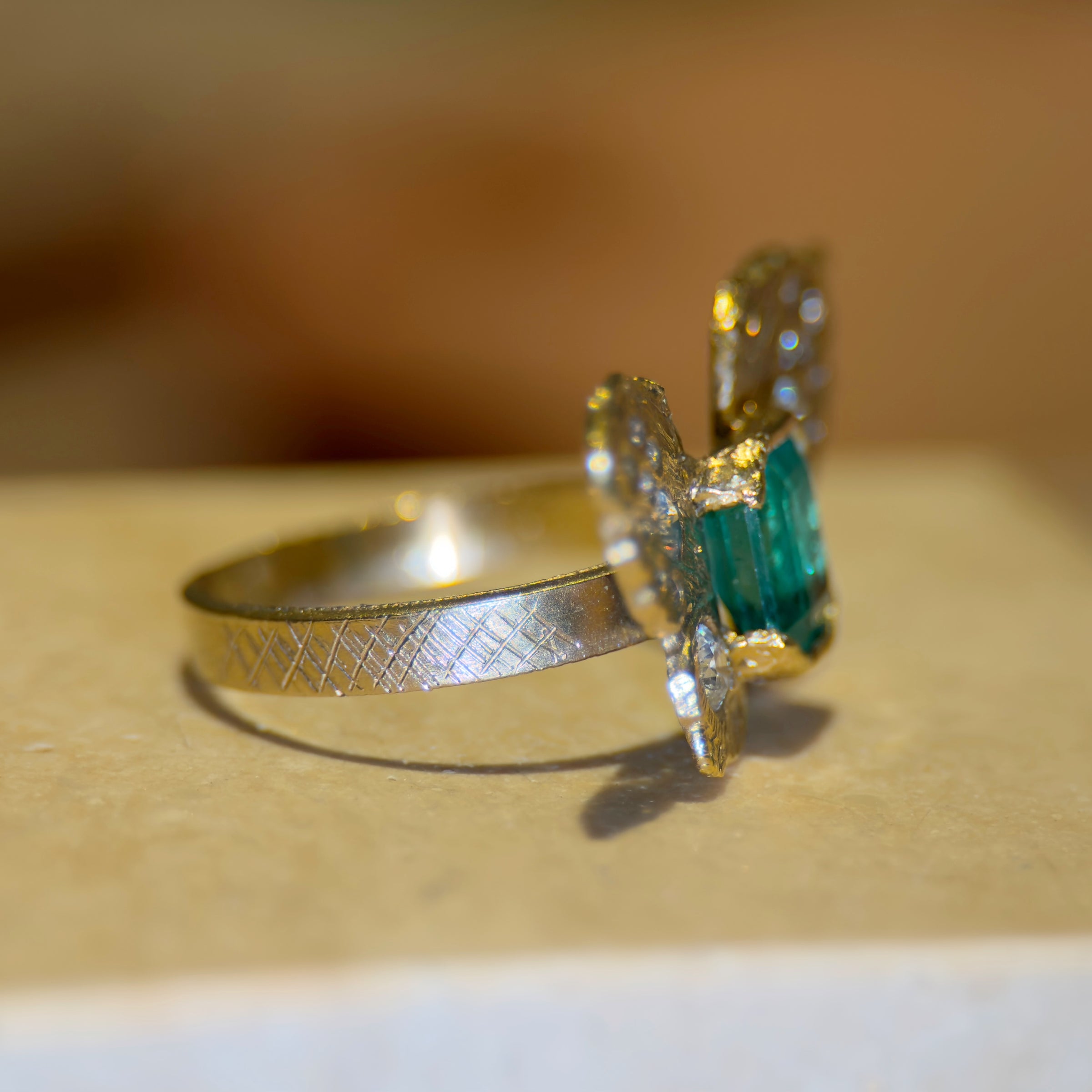 IGI Certified 1.3 Ct Emerald Queen Butterfly Ring with Diamonds in 18 Ct Gold Half Bezel (Available online and also to View in Person at Stardust, London 101 Walton Street)