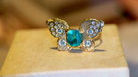 IGI Certified 1.3 Ct Emerald Queen Butterfly Ring with Diamonds in 18 Ct Gold Half Bezel (Available online and also to View in Person at Stardust, London 101 Walton Street)