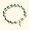 Emerald Bezel Pebbles Tennis Bracelet 18 Ct Gold