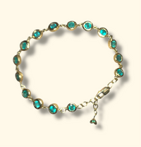 Emerald Bezel Pebbles Tennis Bracelet 18 Ct Gold