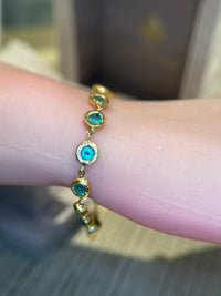 Emerald Bezel Pebbles Tennis Bracelet 18 Ct Gold