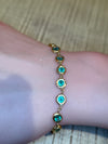 Emerald Bezel Pebbles Tennis Bracelet 18 Ct Gold