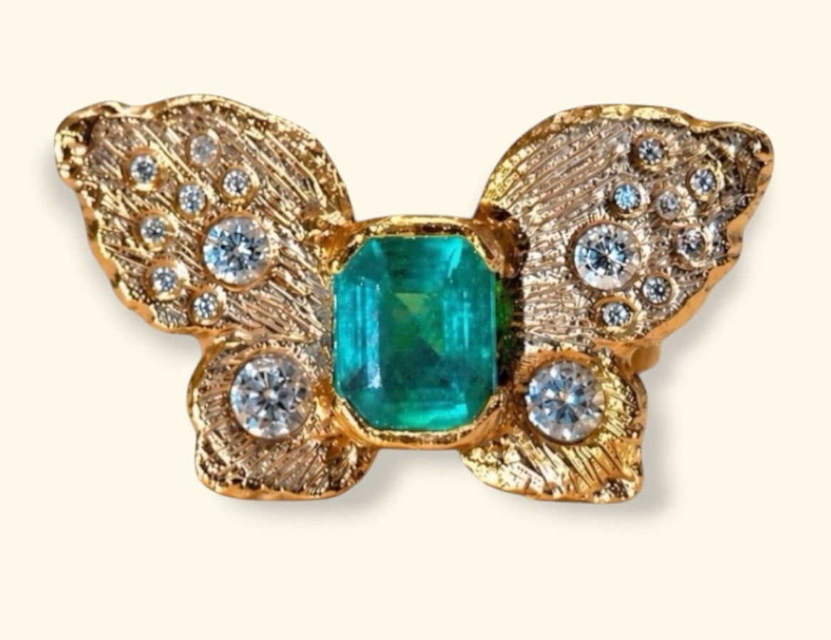 IGI Certified 1.3 Ct Emerald Queen Butterfly Ring with Diamonds in 18 Ct Gold Half Bezel (Available online and also to View in Person at Stardust, London 101 Walton Street)
